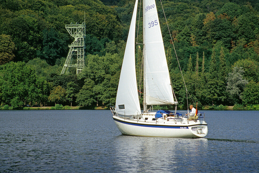 Shaft tower and sailboat on lake Baldeney, Essen, Ruhr, Ruhr valley, Ruhr area, North Rhine Westphalia, Germany