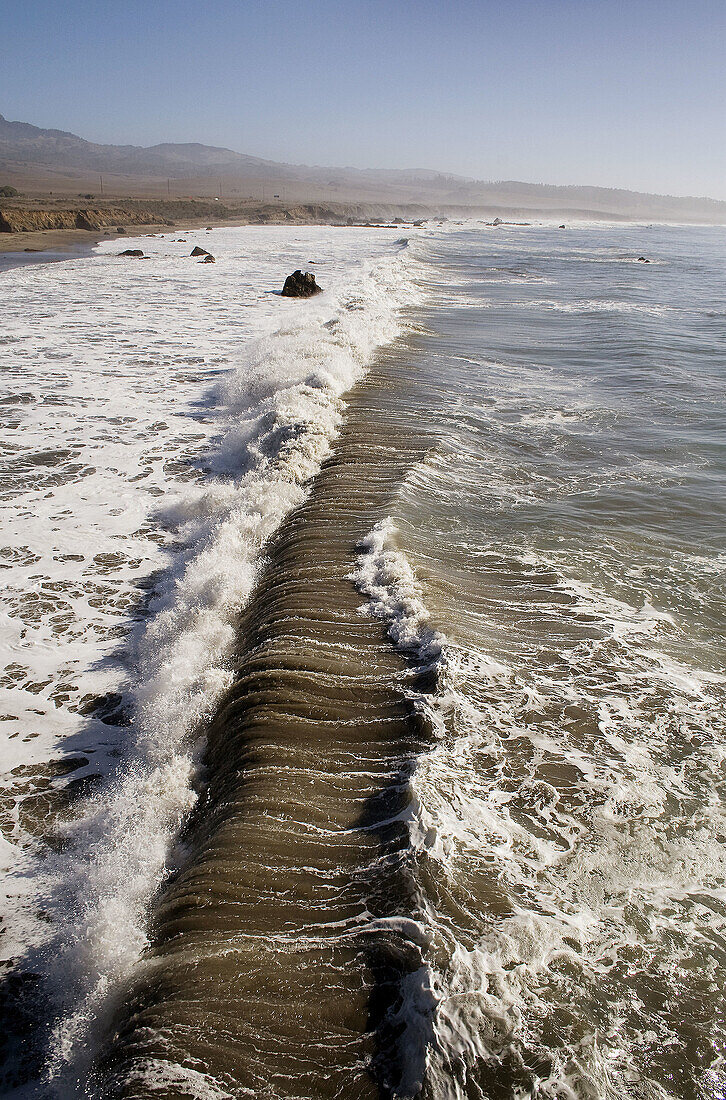 High waves in San Simeon, California, along the Big Sur coastline. USA