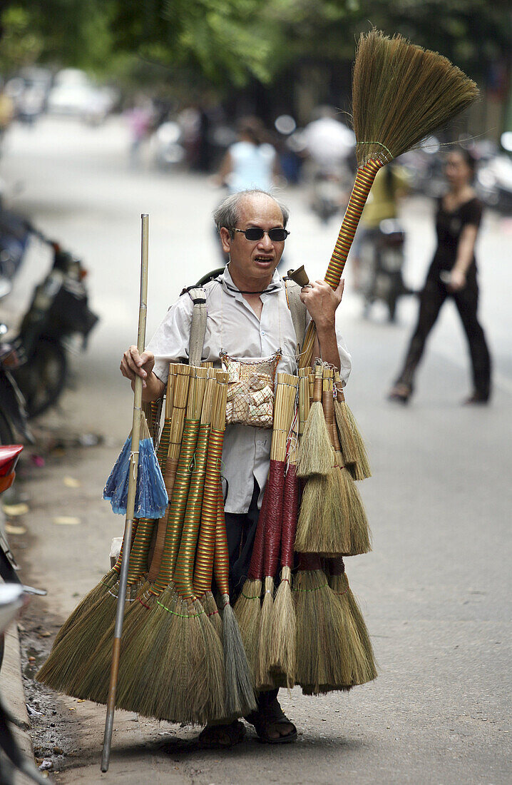 Broom seller. Hanoi. Vietnam.