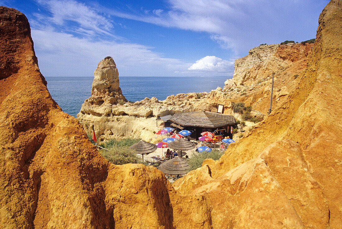 Beachside cafe between the rocks at the coast, Algar Seco, Algarve, Portugal, Europe