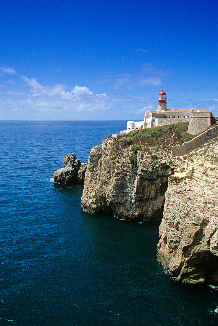 Lighthouse at Cabo de Sao Vicente under blue sky, Algarve, Portugal, Europe