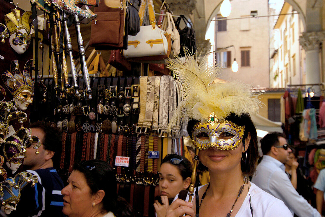 Tourist with mask at Mercato del Porcellino, Loggia del Mercato Nuevo, Florence, Tuscany, Italy, Europe