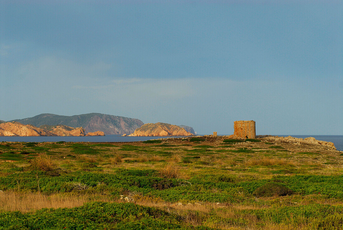 Landscape with old tower at Cap de Cavallaria, Menorca, Balearics, Spain