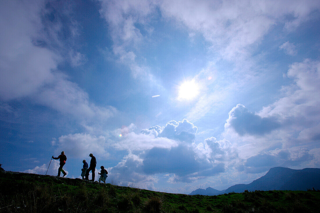 Group hikers on mount Wallberg, Tegernsee, Bavaria, Germany