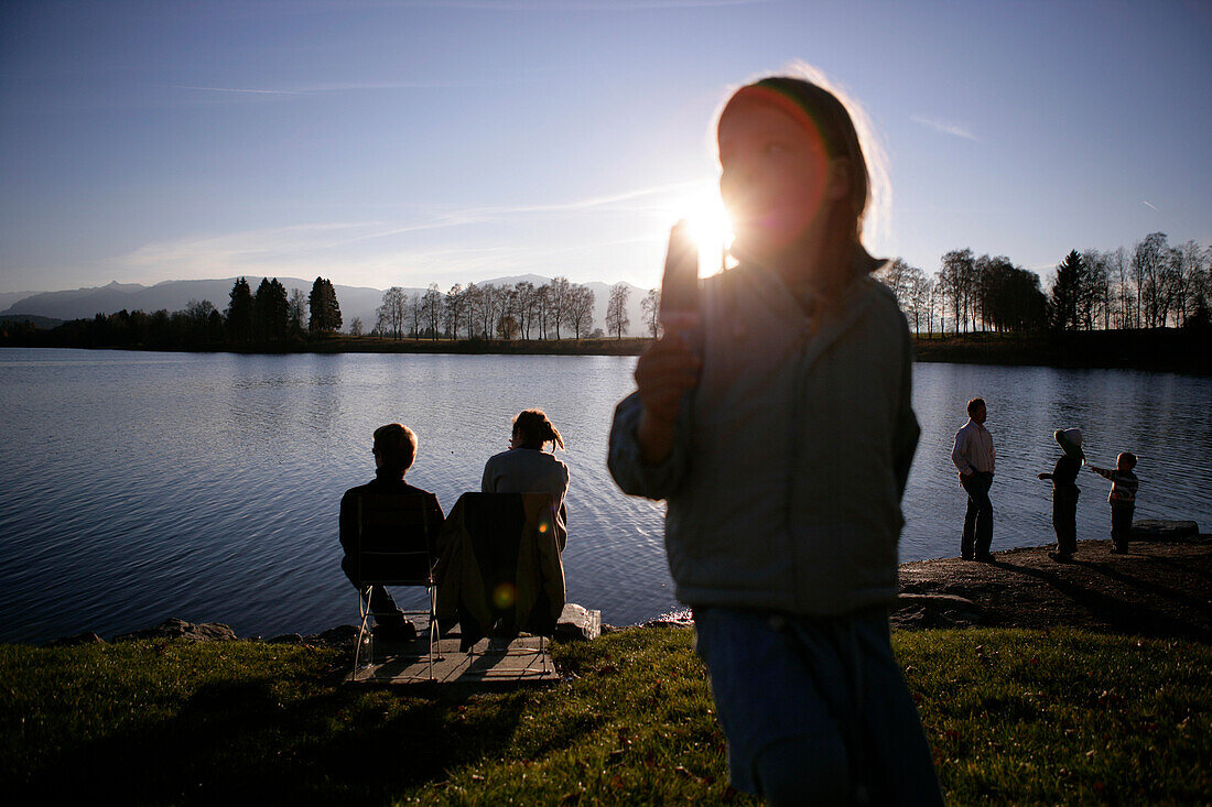 People at lake Staffelsee, Uffing, Bavaria, Germany