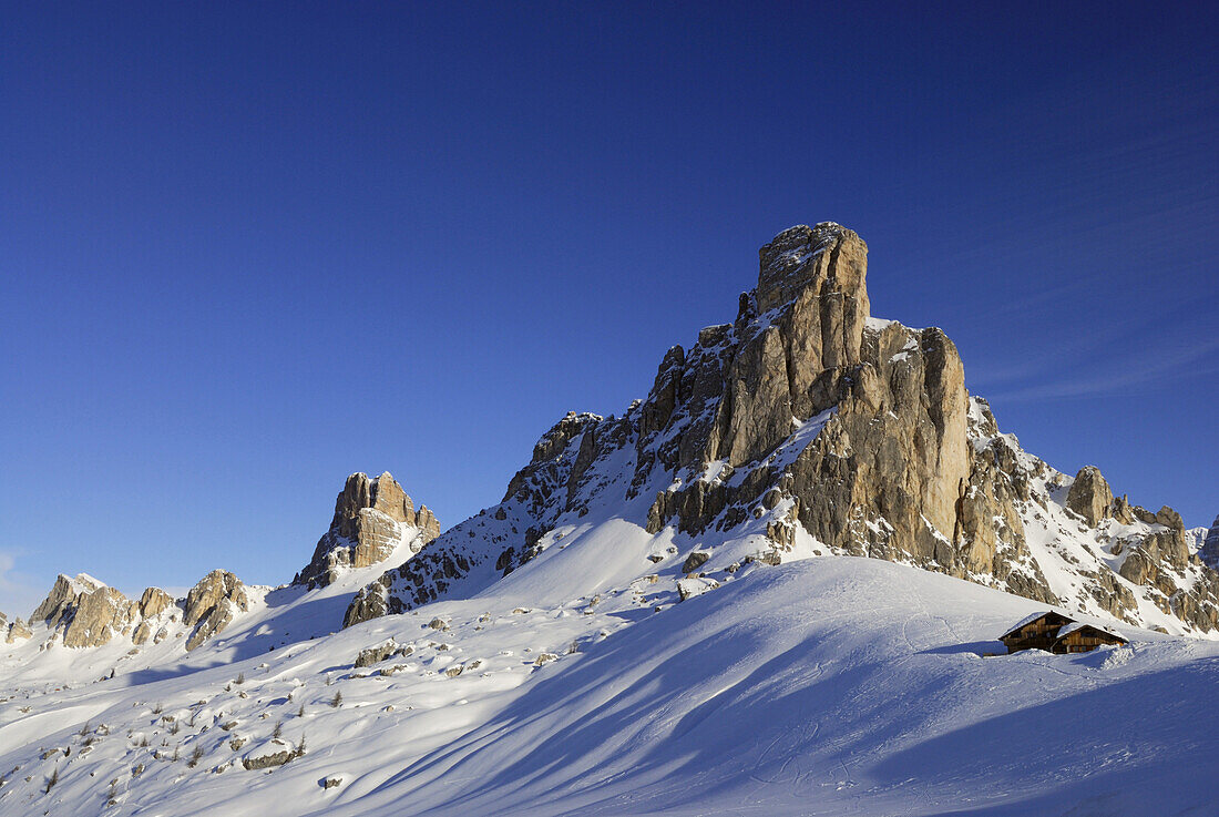 Snow-covered alpine lodge, Giau Pass, Dolomites, Veneto, Italy