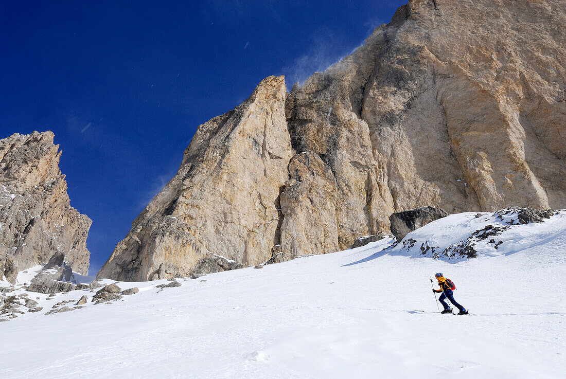 Woman backcountry skiing, Rotwand, Rosengarten group, Dolomites, Trentino-Alto Adige/Südtirol, Italy