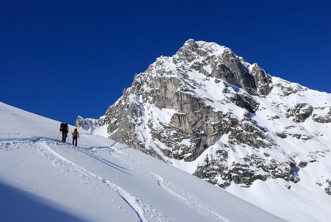 Two backcountry skiers ascending to Tajakopf, Tajatoerl, Mieminger range, Tyrol, Austria