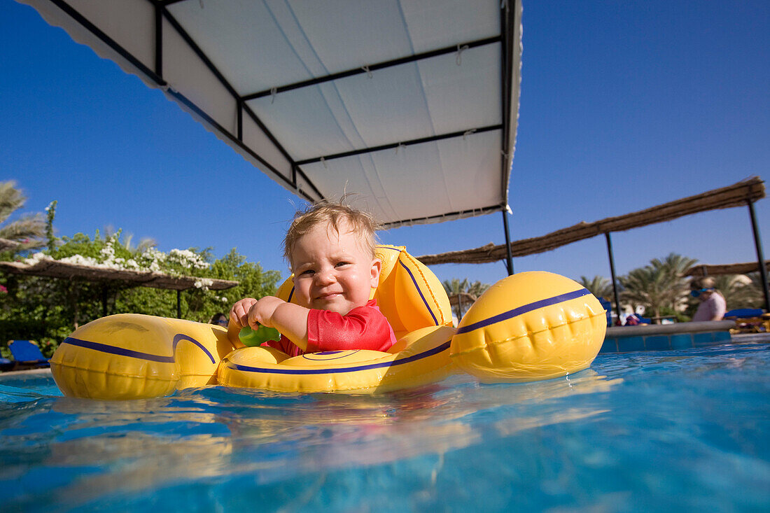 A little child, girl in the childrens swimming pool, Lamaya Resort, Coraya, Marsa Alam, Red Sea, Egypt