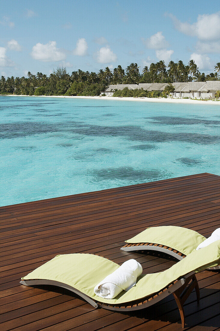 Chairs and water Villa Resorts. Maldives Island, Indian Ocean.