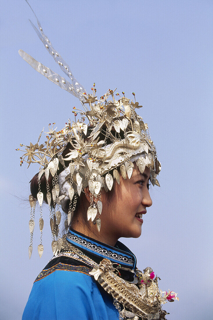 Miao woman with silver headdress, duan new year festival, dabian village, guizhou, China