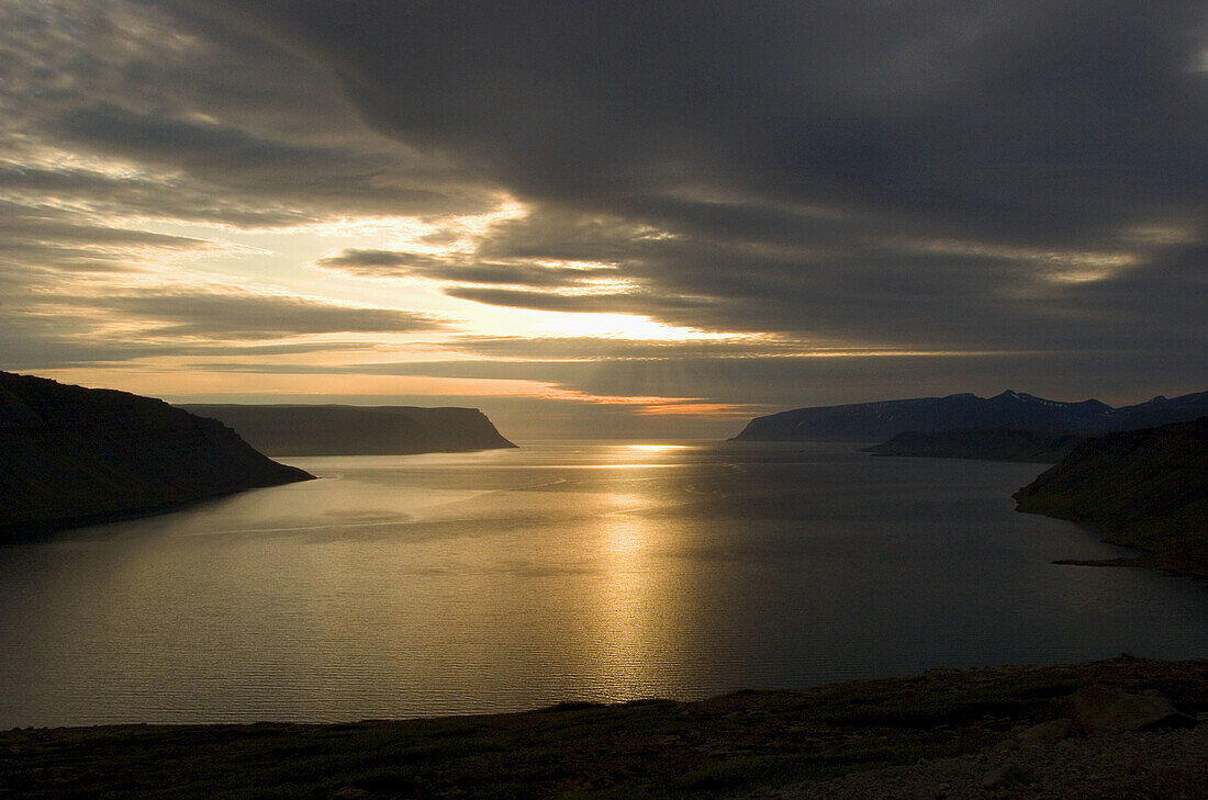 Summer Midnight Sun over a Fjord in Northern Iceland