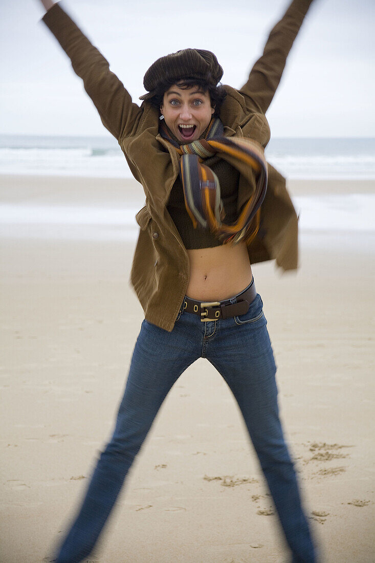 Portrait of a happy young woman jumping