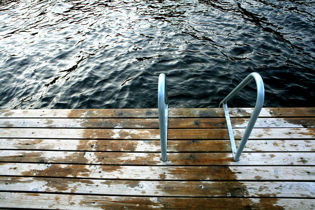 View at a wet jetty at a lake, Saimaa Lake District, Finland, Europe