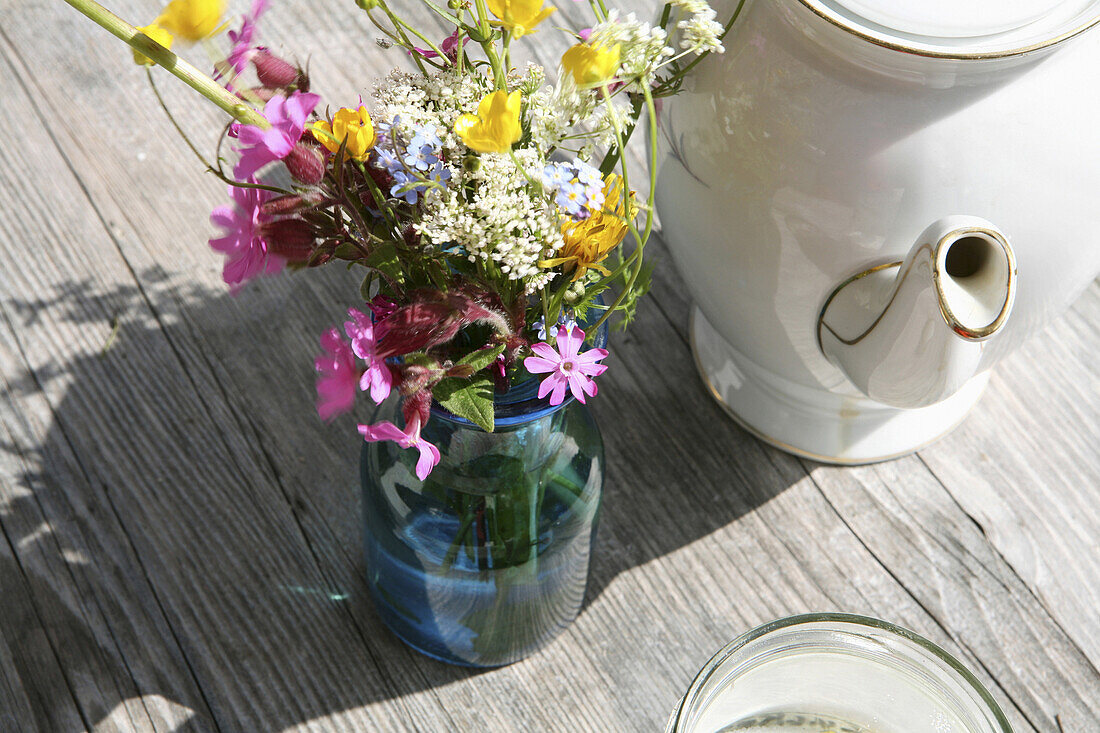 A bouquet of meadow flowers on a wooden table, Arzmoos, Sudelfeld, Bavaria, Germany