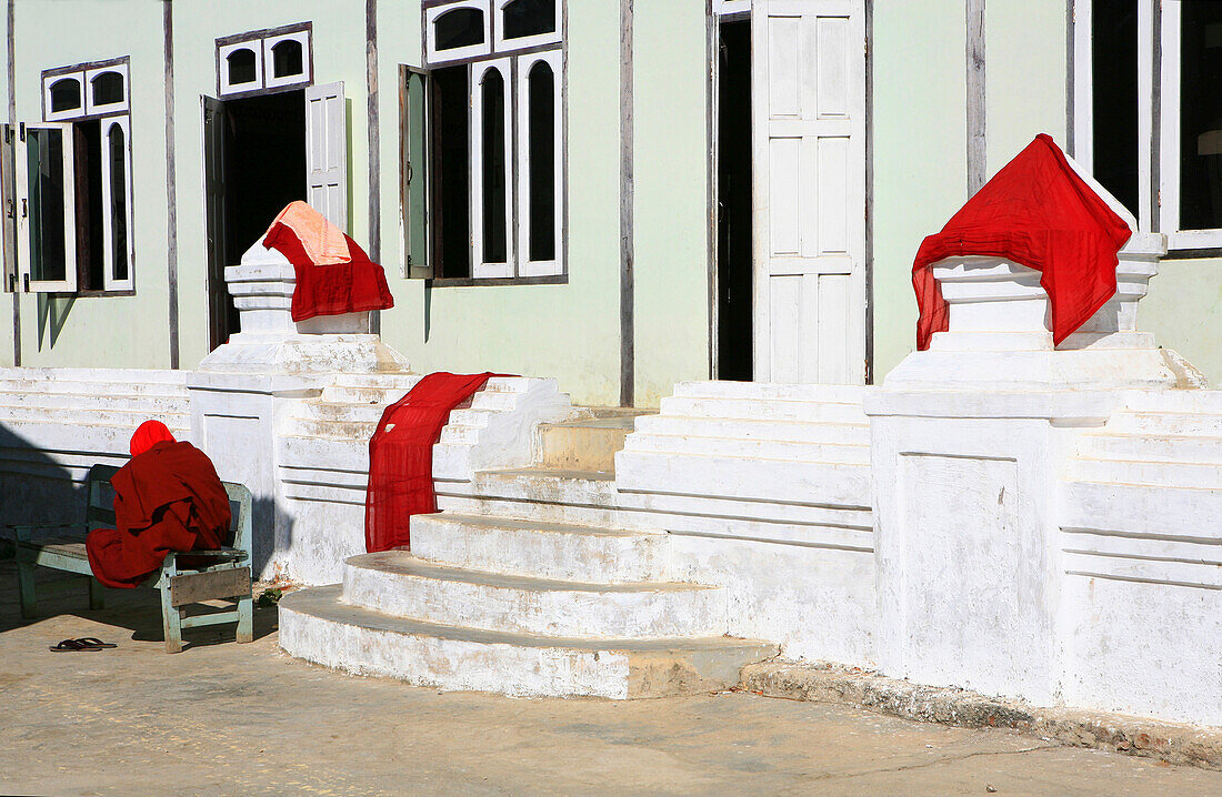 Old buddhist monk meditating at the courtyard of Shwe Yan Bye Monastery, Nyaungshwe, Shan State, Myanmar, Burma, Asia