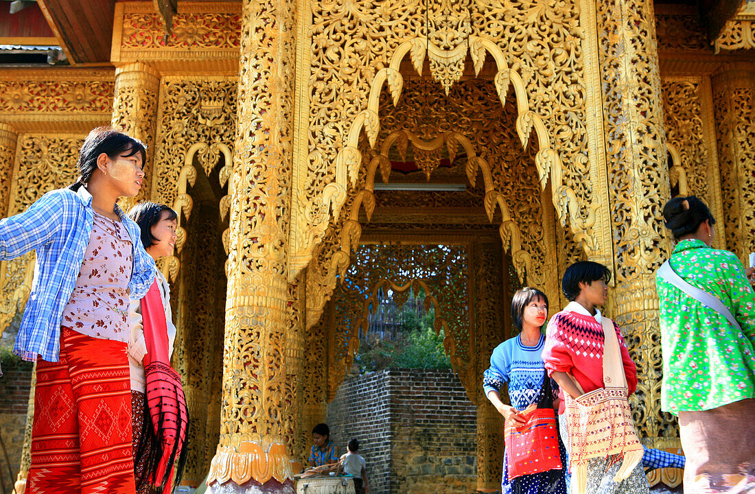 Women standing in front of the Popa Taung Kalat monastery, Mount Popa, Myanmar, Burma, Asia