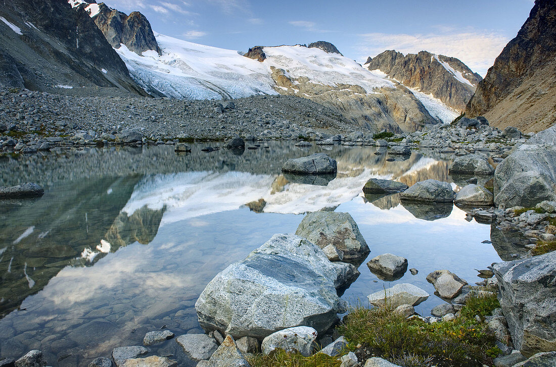 Glaciated Peaks of Boulder/Salal Divide reflected in waters of a terminal glacial lake near Athelney Pass, Coast Range British Columbia Canada