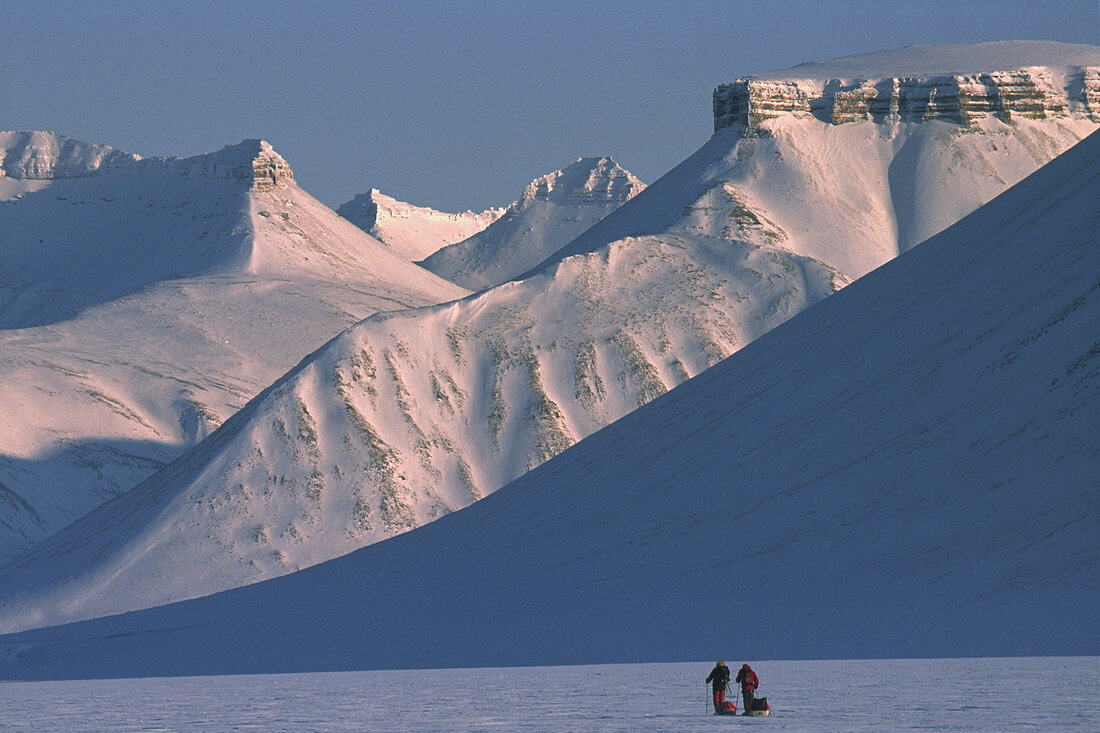 Ski tourers spring ski traverse Ny Alesund to Longyearbyen Spitsbergen Island Svalbard Norwegian Arctic