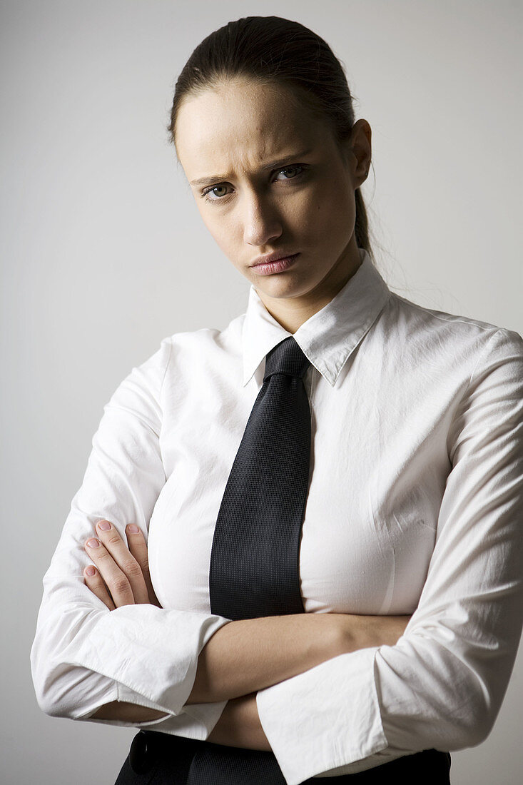 Adult, Adults, Angry, Arms crossed, Arms folded, Bad mood, Brunette, Brunettes, business, Businesspeople, Businessperson, Businesswoman, Businesswomen, Caucasian, Caucasians, Clipping path, Color, Colour, Contemporary, Cross arms, Cross-armed, Crossed arm