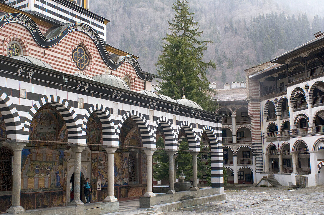 Rila monastery, inner court, Mary`s Birth Church and residential building, view to the surrounding forests, Bulgaria