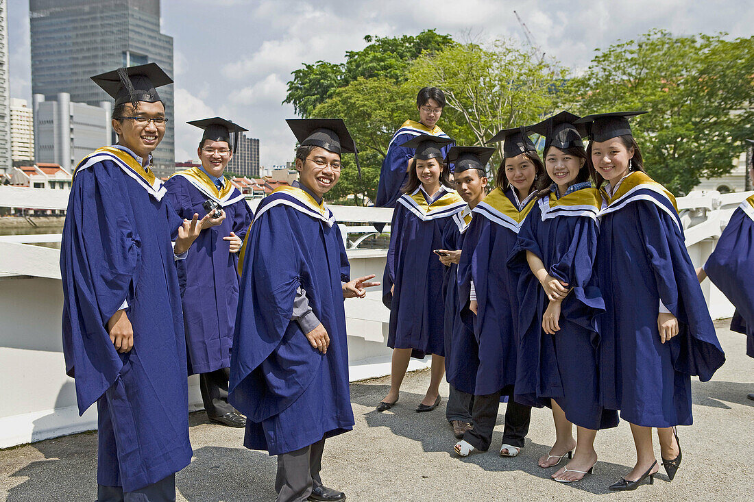 Celebrating graduation in Singapore on the Cavanagh Bridge