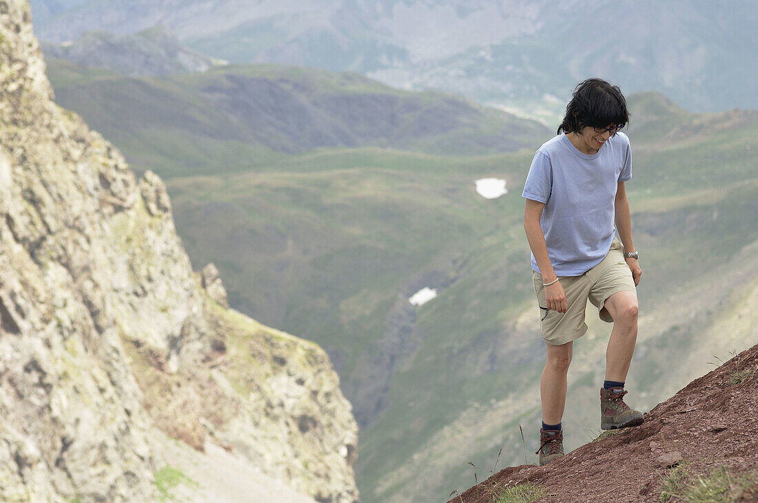 Hiker climbing to Anayet, Valle de Canal Roya. Canfranc, Pyrenees Mountains, Huesca province, Aragon, Spain