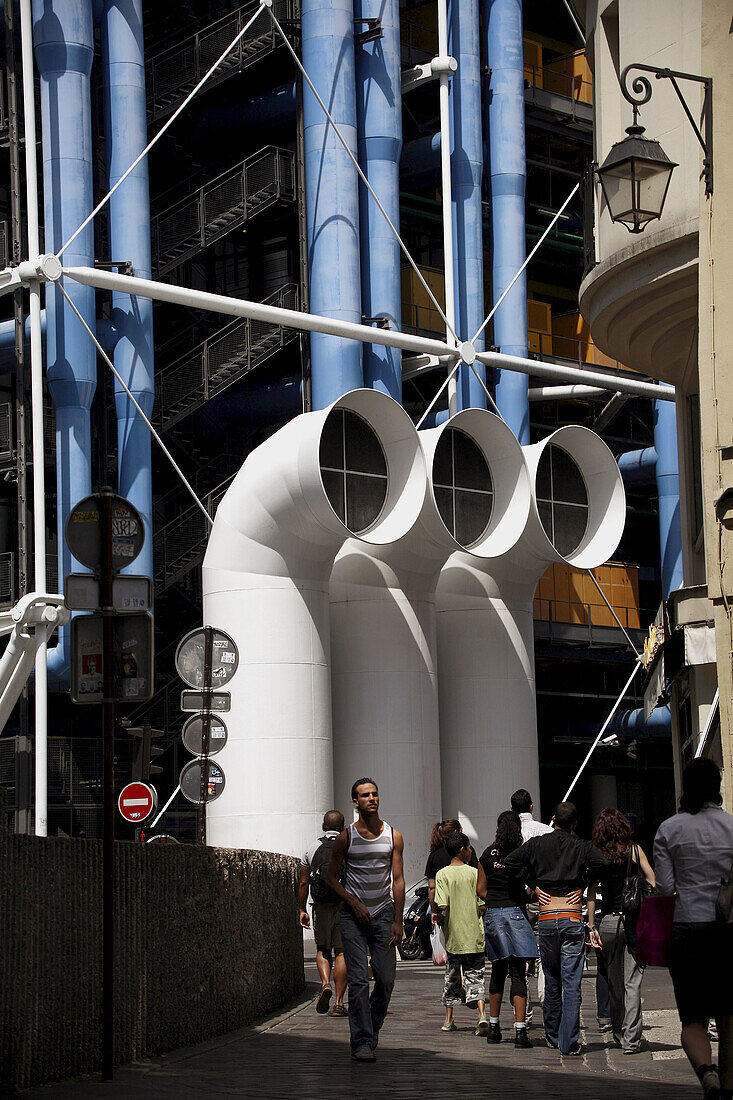 France. Paris. Pedestrians on the street with Pompidou Centre in the background.