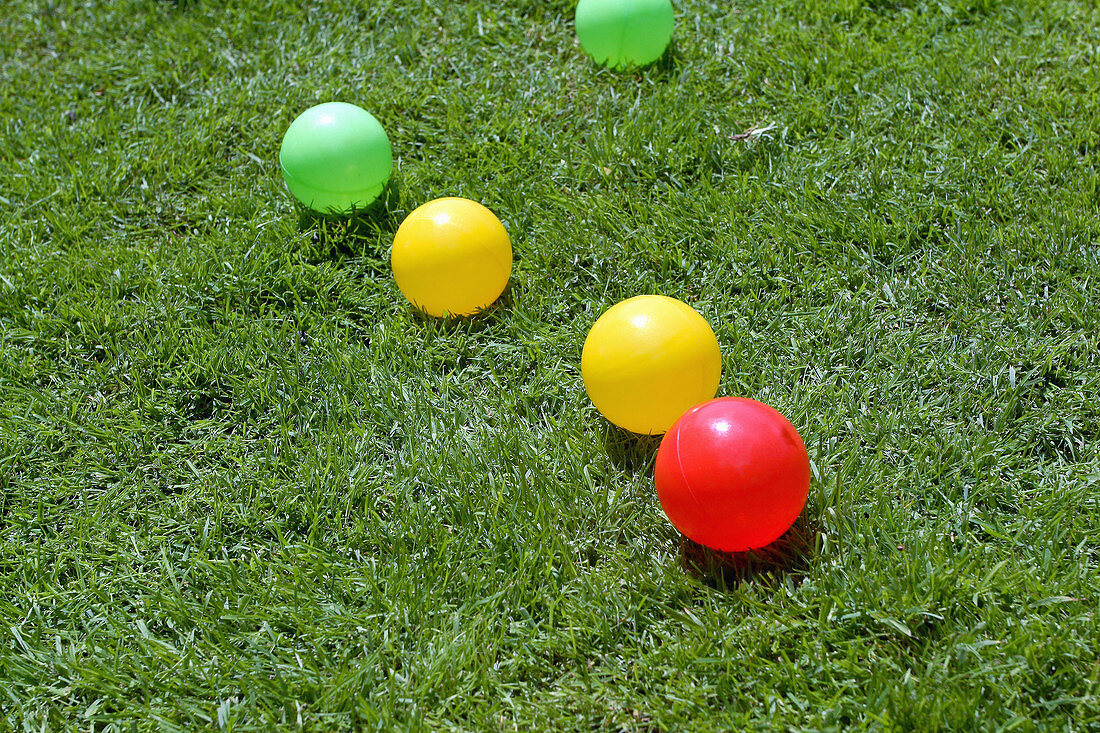 Plastic balls on garden lawn