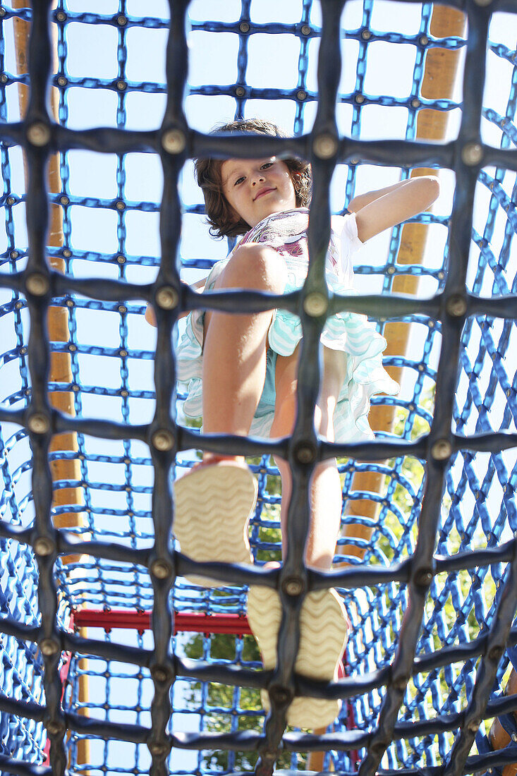 5 year old girl playing in park