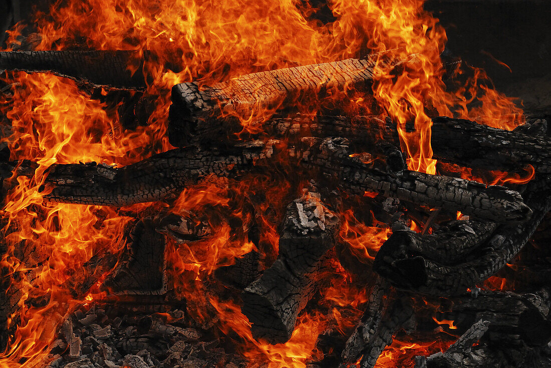 Burning fire by river Ganges, Varanasi, India