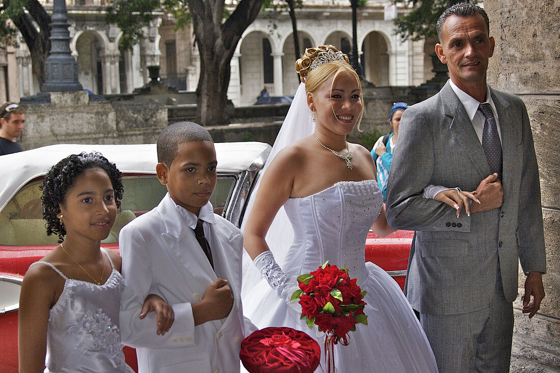 A bride and groom, with attendants just before the wedding ceremony.