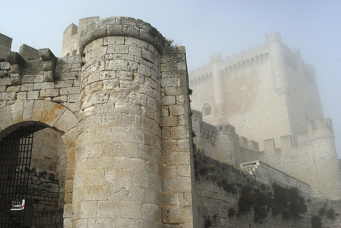 Castle of Peñafiel, in Valladolid province, Castilla Leon, Spain  In the morning with fog  This is the entrance to the castle and the Homenaje Tower