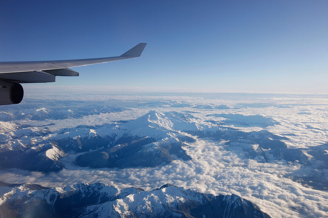 View through airplane window over Rocky Mountains, Oregon, USA