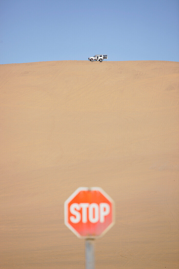 Car driving on sand dunes near Swakopmund, Namibia, Africa