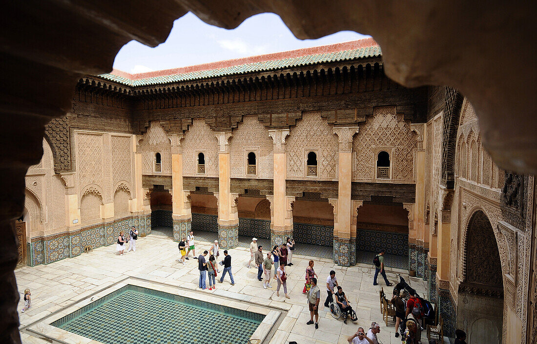 Tourists at the atrium of the Medersa Ben Youssef, Marrakesh, South Morocco, Morocco, Africa