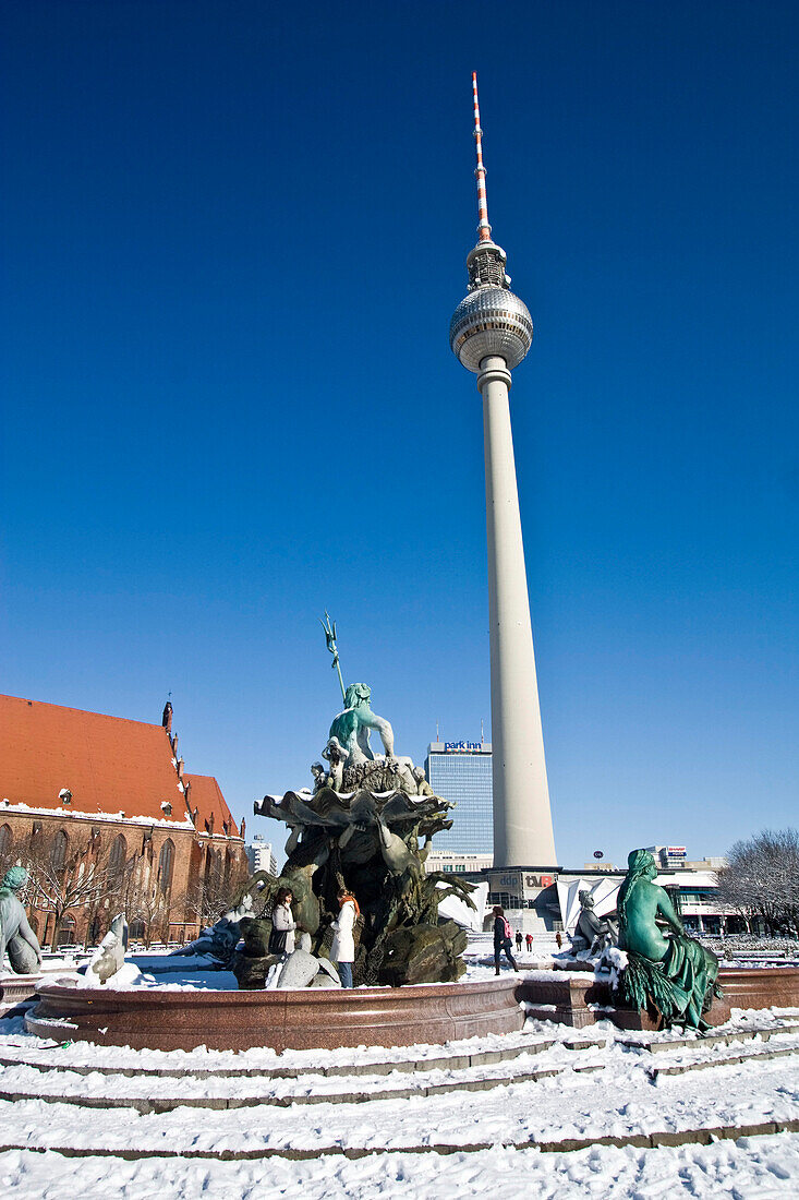 snow at Neptun fountain in front of Alex in Berlin center