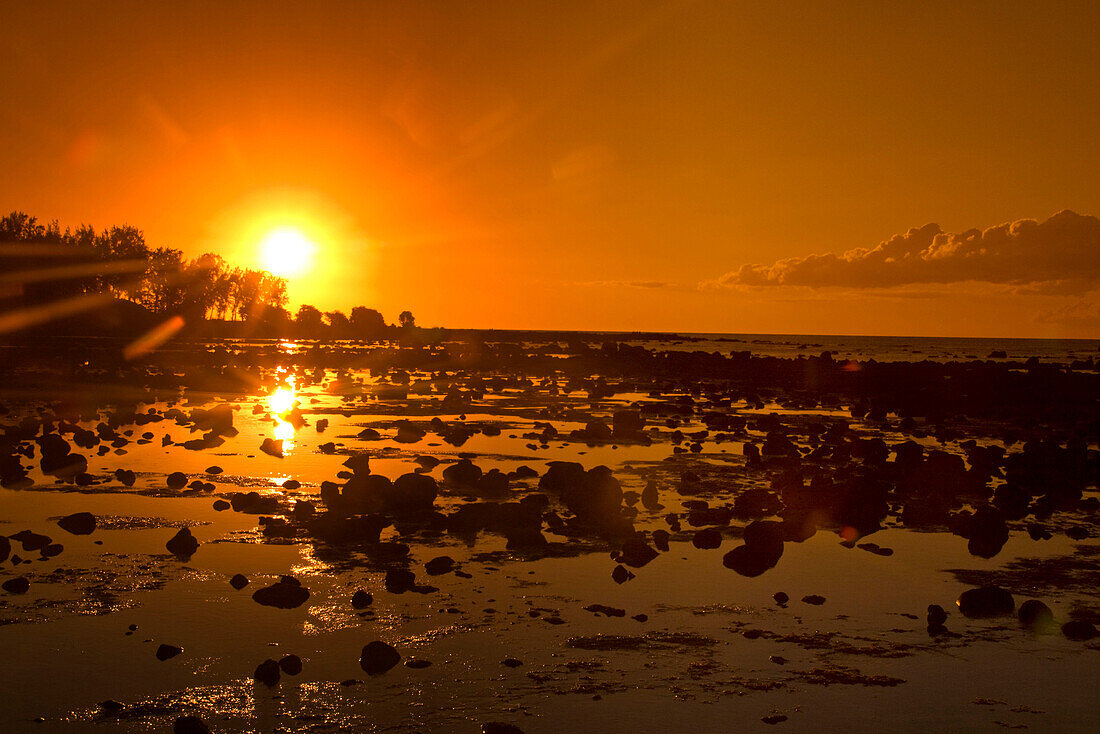 Sunset at Trou aus Biches beach at low tide, Mauritius, Africa