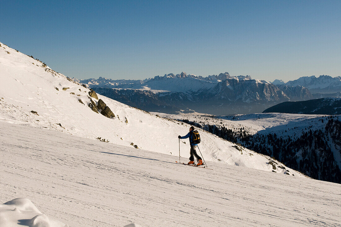 Man on an alpine ski tour, ski touring, back country skiing equipment, Reinswald Skiing area, Sarn valley, South Tyrol, Italy