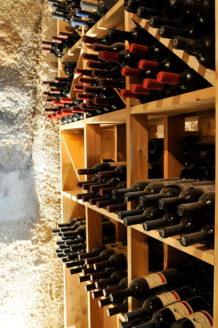 Wine rack with wine bottles, restaurant Zum Löwen, Chef Anna Matscher, Tisens, South Tyrol, Italy