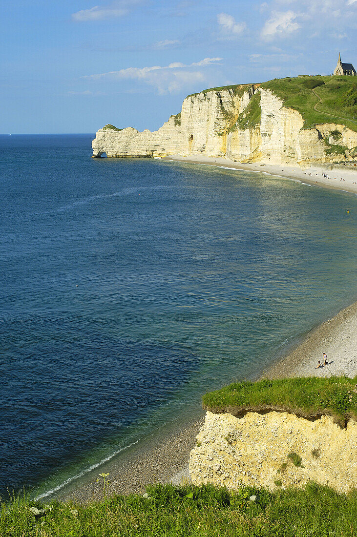 Porte dAmont cliff and Notre Dame de la Garde church, Étretat. Haute-Normandie. Normandy, France