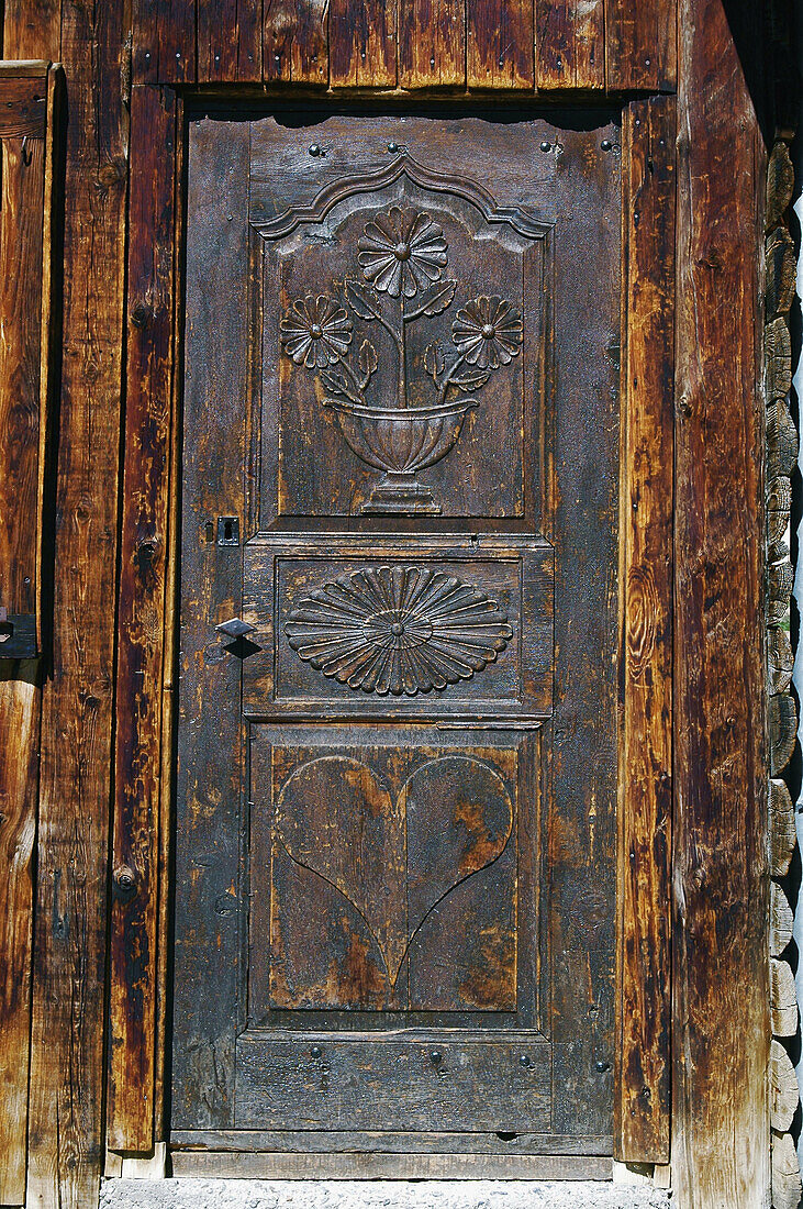 Carved door, Saint-Véran, Queyras Regional Natural Park. Hautes-Alpes, France