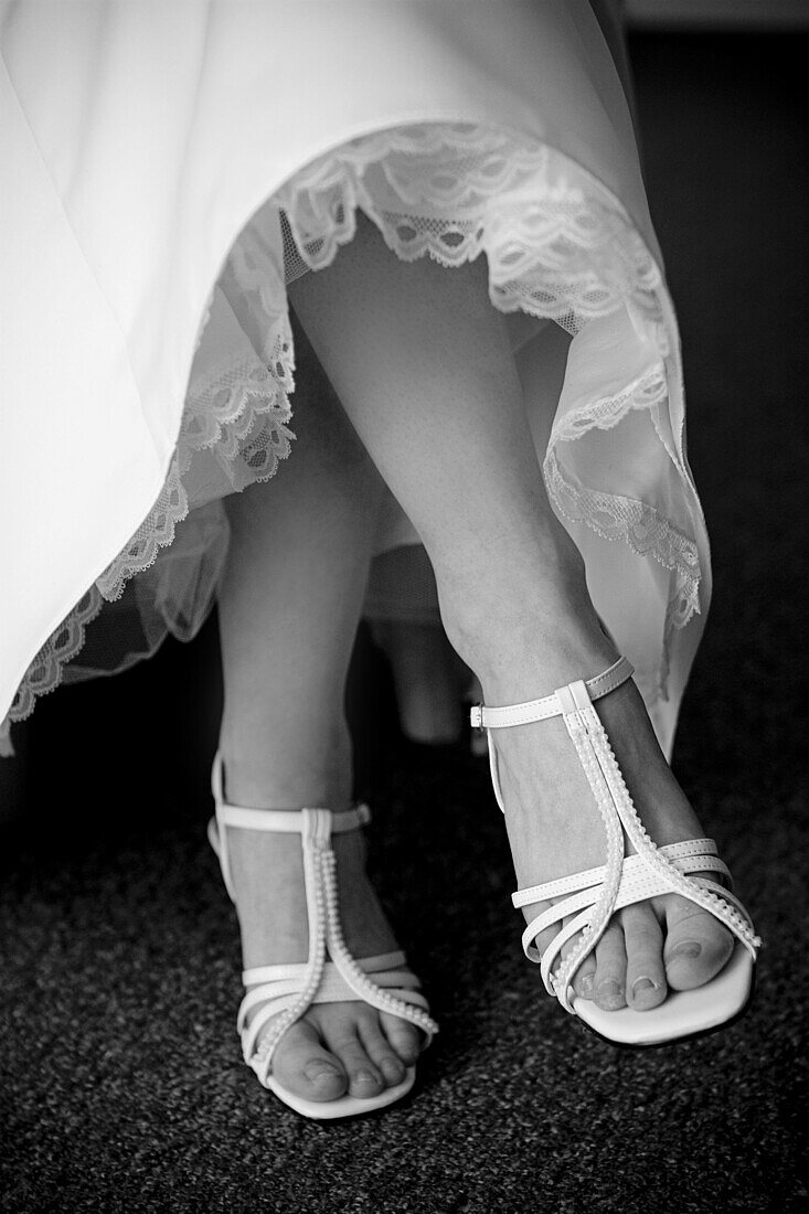 Accessories, Accessory, Adult, Adults, b&w, black-and-white, bride, brides, Contemporary, Cross legged, Crossing legs, detail, details, Dress, Dresses, Feet, Female, Foot, Footgear, Footwear, human, indoor, indoors, interior, Legs crossed, marriage, matri