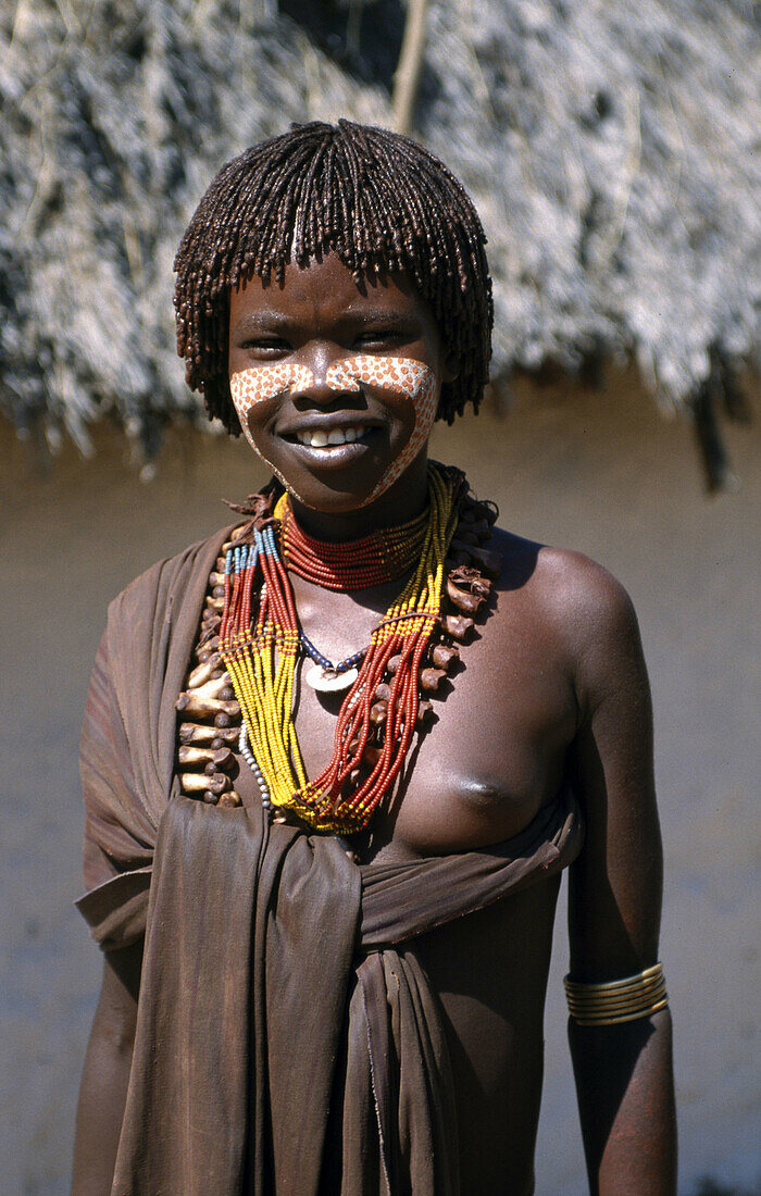 young Hamer girl in the market in the Omo Valley of Ethiopia