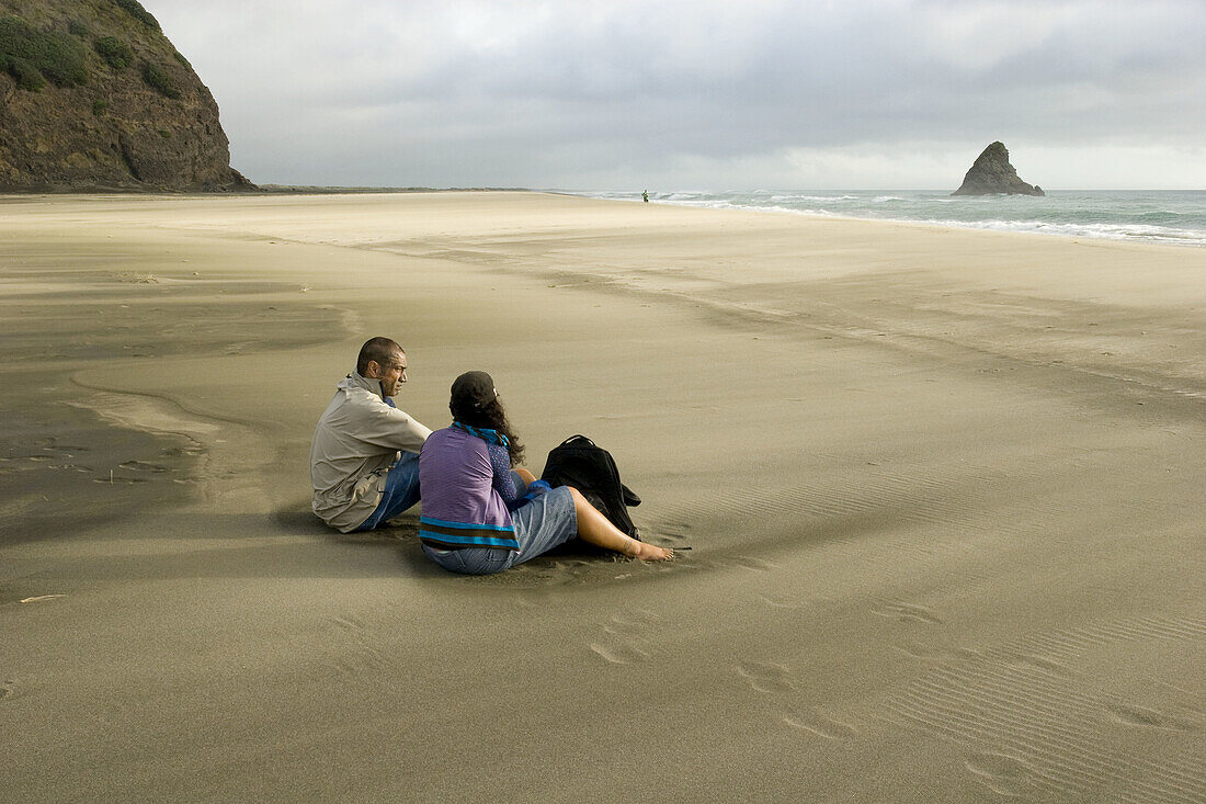 Maori Woman and Man resting on Waipoua Beach