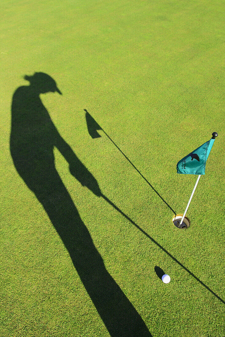 Golfer putting at a practise green