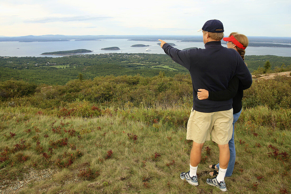 a couple viewing bar harbor from cadillac mountain acadia NP in maine usa