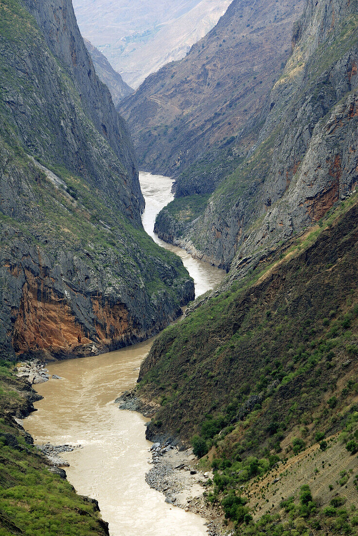 Tiger Leaping Gorge pinyin: Hutiào Xiá is a canyon on the Yangtze River - locally called the Golden Sands River, located 60 km north of Lijiang City, Yunnan in southwestern China