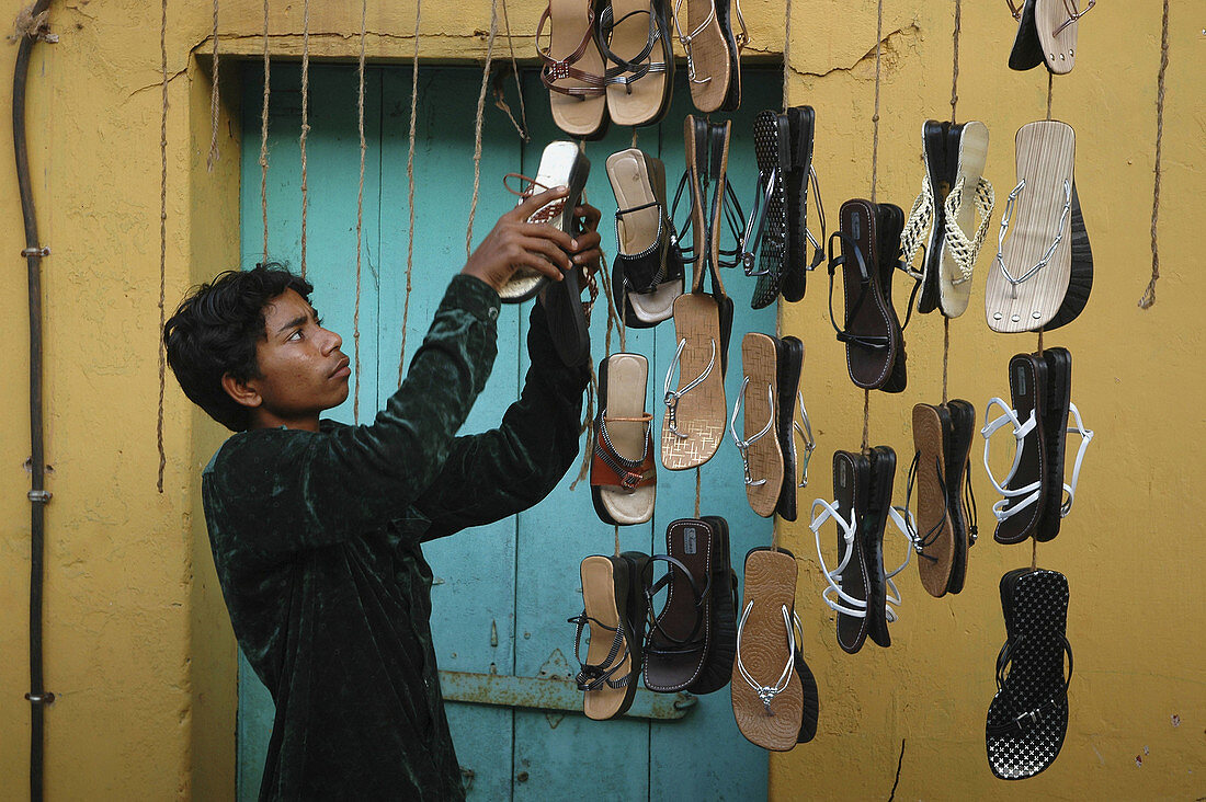 Panjim Goa, India: shoes seller during the Maruti Zatra feast