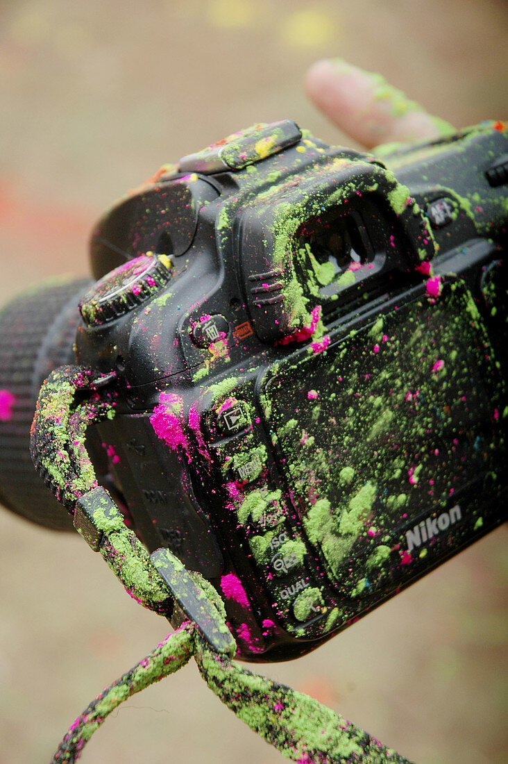 Panjim Goa, India, camera dirty with colored powder during the Holi feast
